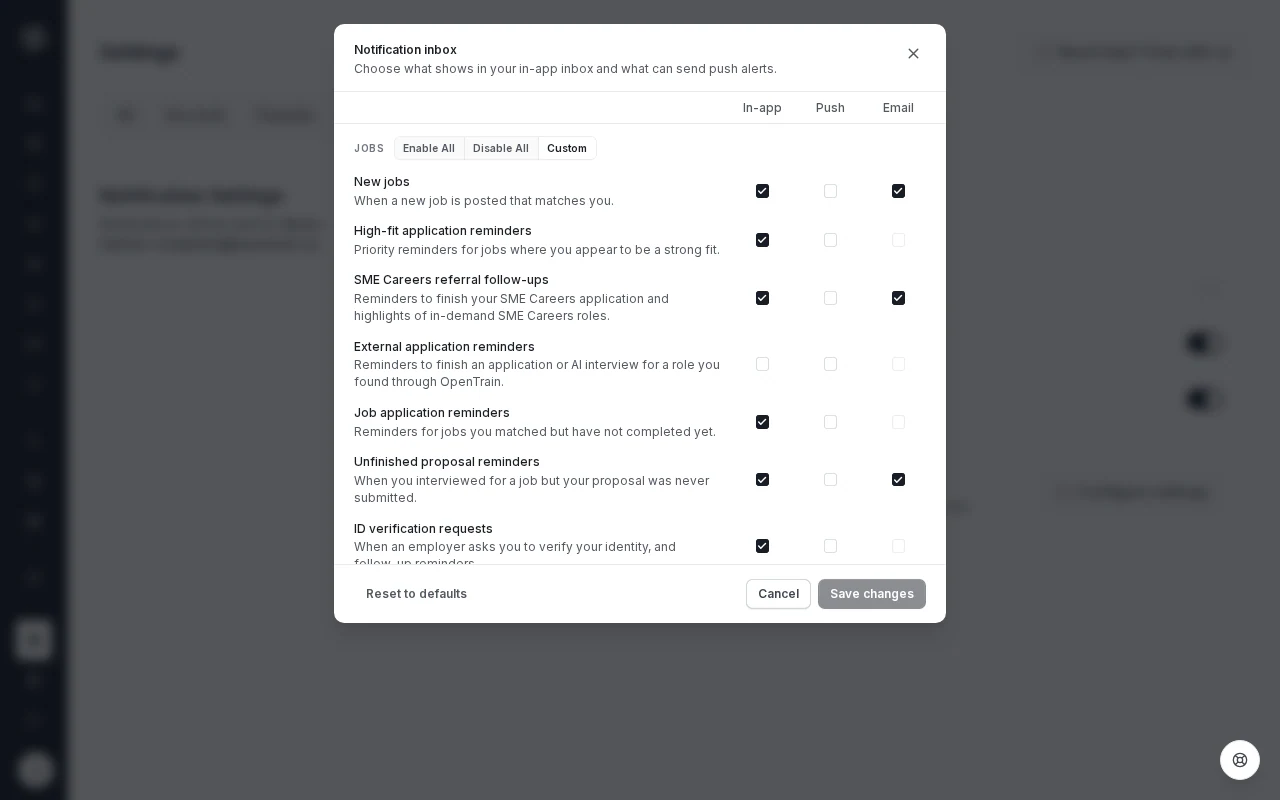 The Notification inbox window with In-app, Push and Email columns. The Jobs group lists New jobs, High-fit application reminders, External application reminders, Job application reminders and Unfinished proposal reminders, each with its own checkboxes. Some Email checkboxes are dimmed.