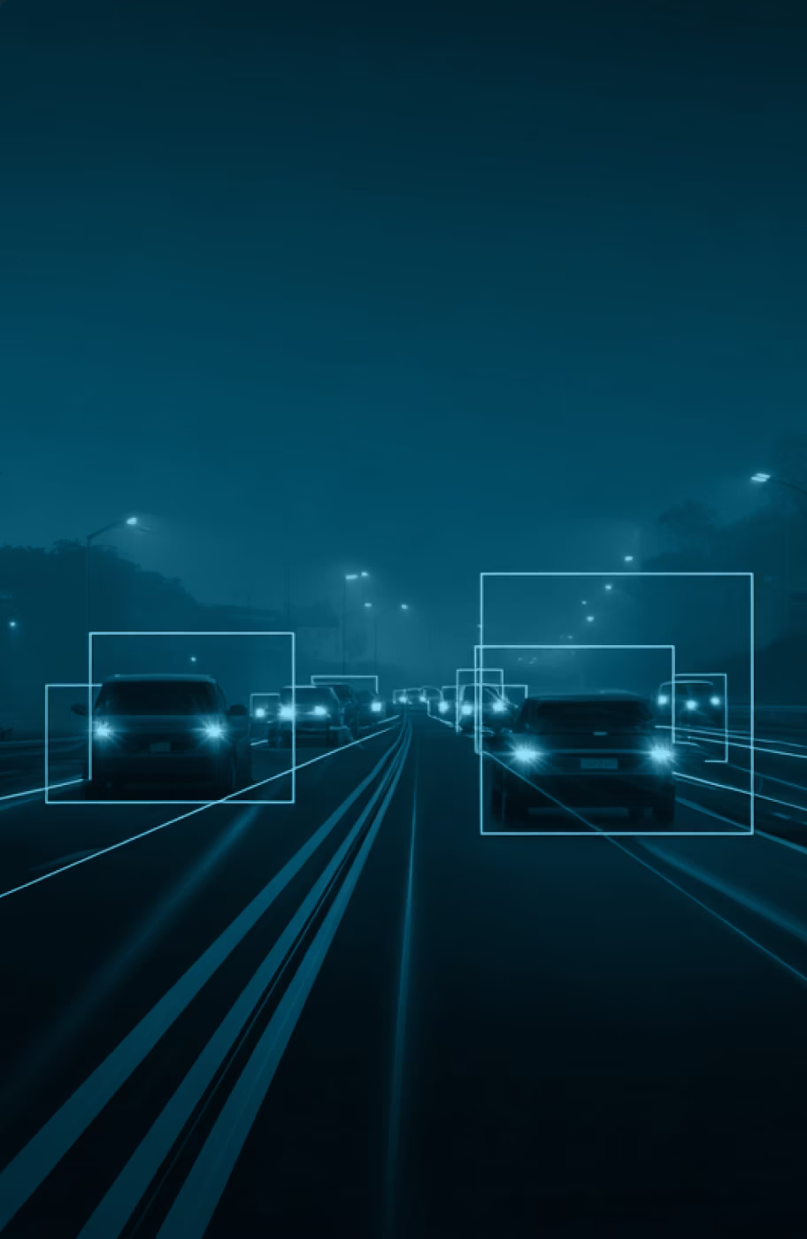 Nighttime highway scene with bounding boxes overlaid on vehicles representing object detection and tracking in video annotation for autonomous driving applications.